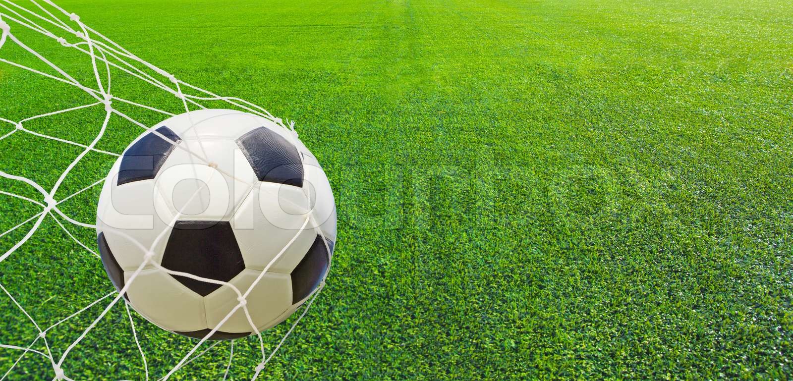 Soccer ball in a net Stock image Colourbox