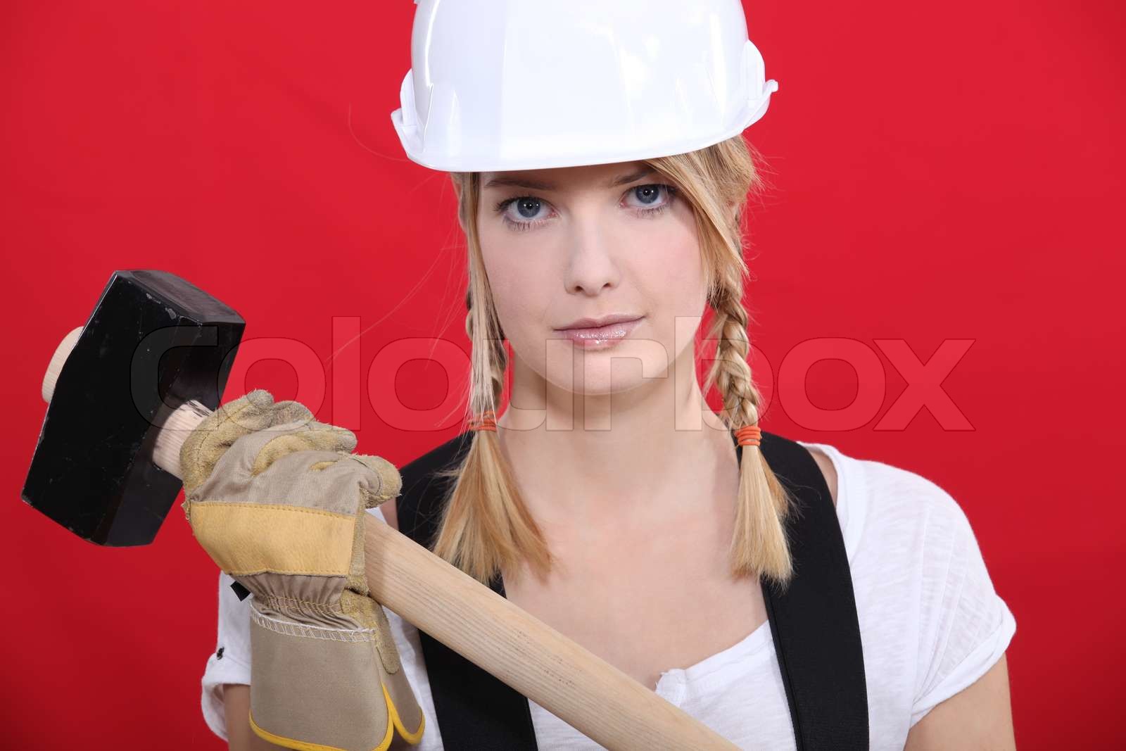 Girl holding Hammer Stock Bild Colourbox