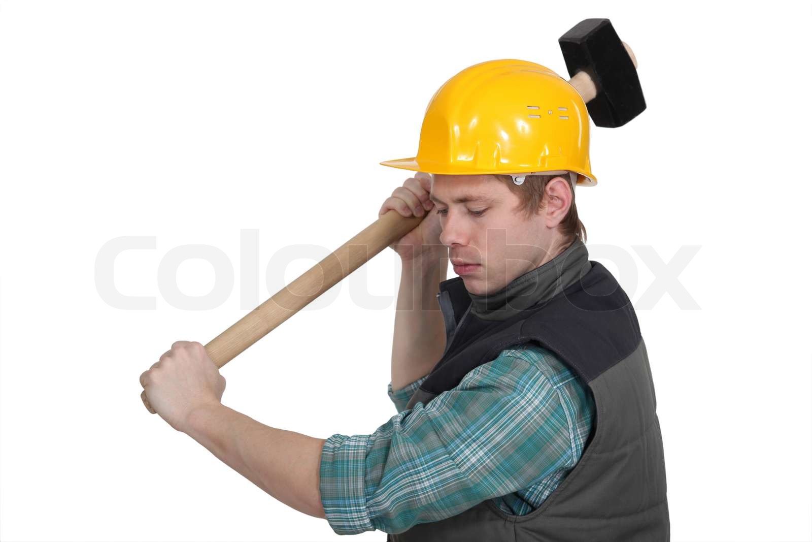 junge Handwerker arbeiten mit einem riesigen Hammer | Stock Bild ...