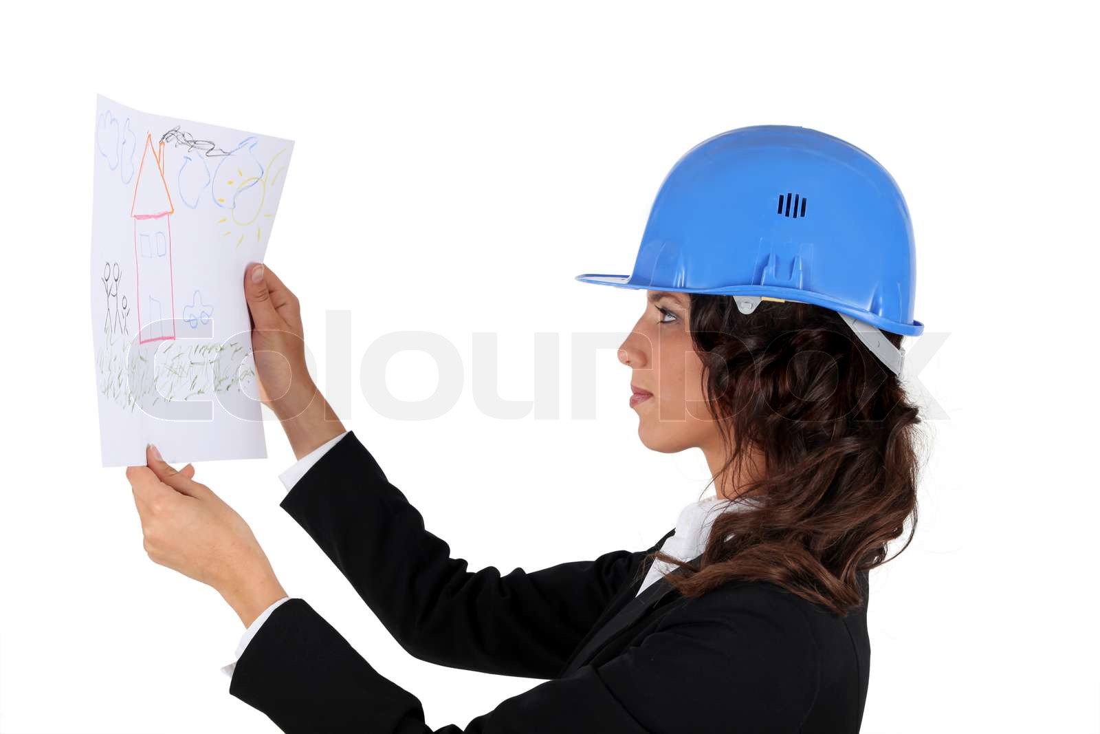En ingeniør inspicere tegning | Stock foto | Colourbox