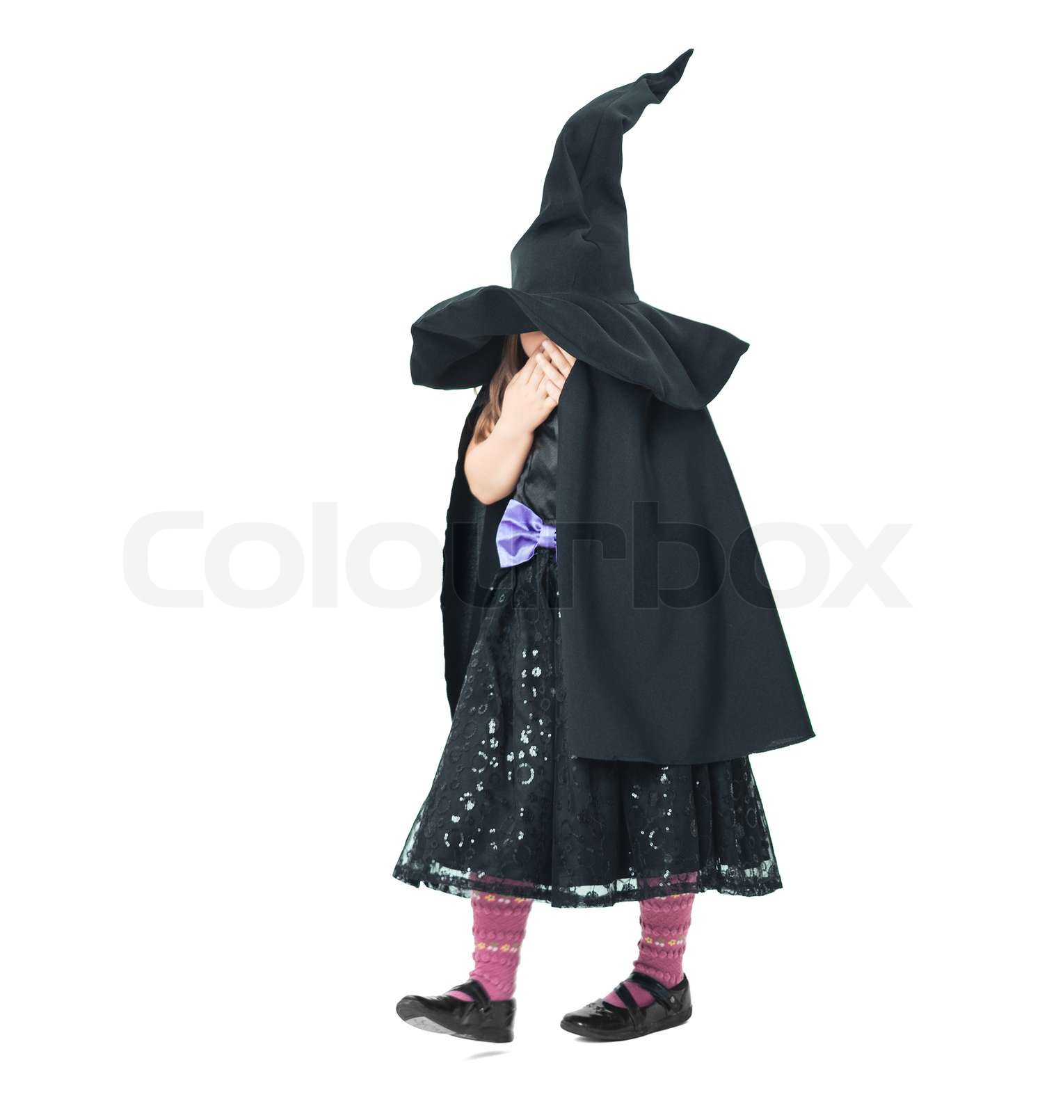 laughing witch hiding behind | Stock image | Colourbox