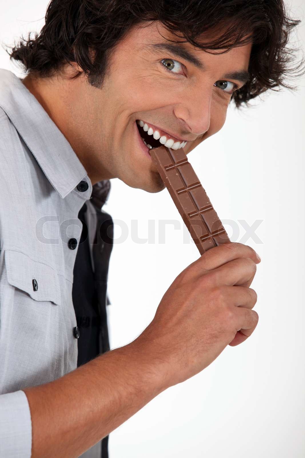 mand spiser chokolade | Stock foto | Colourbox