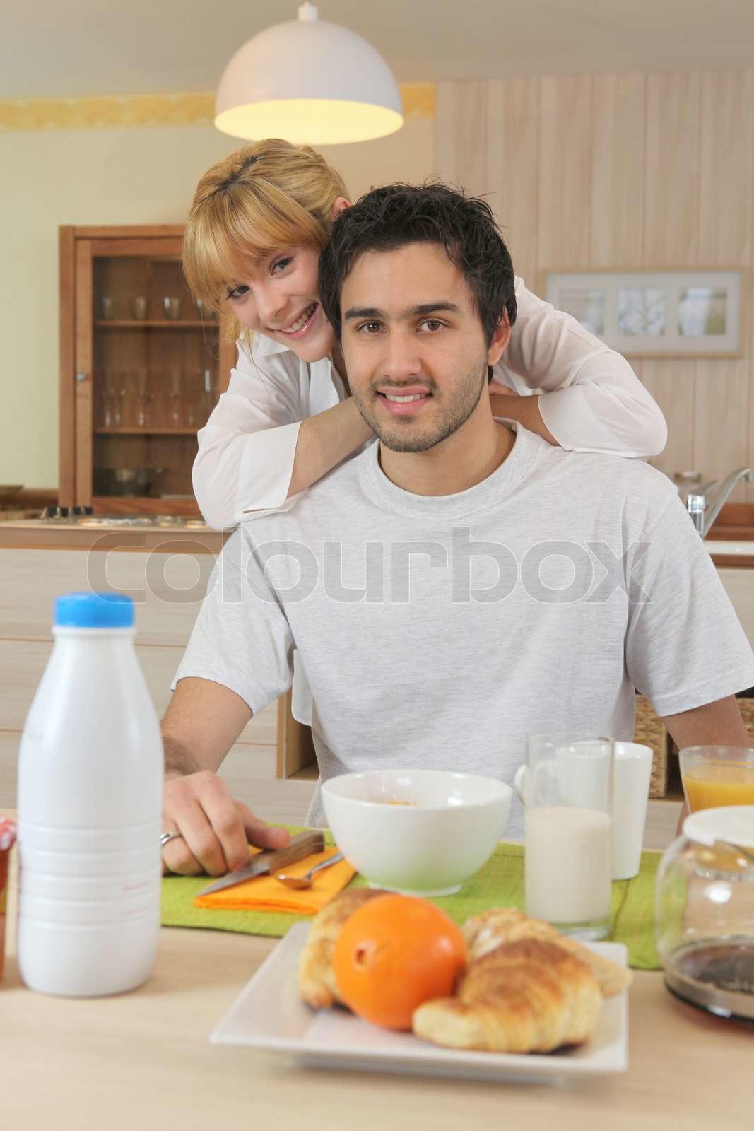 Smiling boy and girl breakfasting | Stock image | Colourbox
