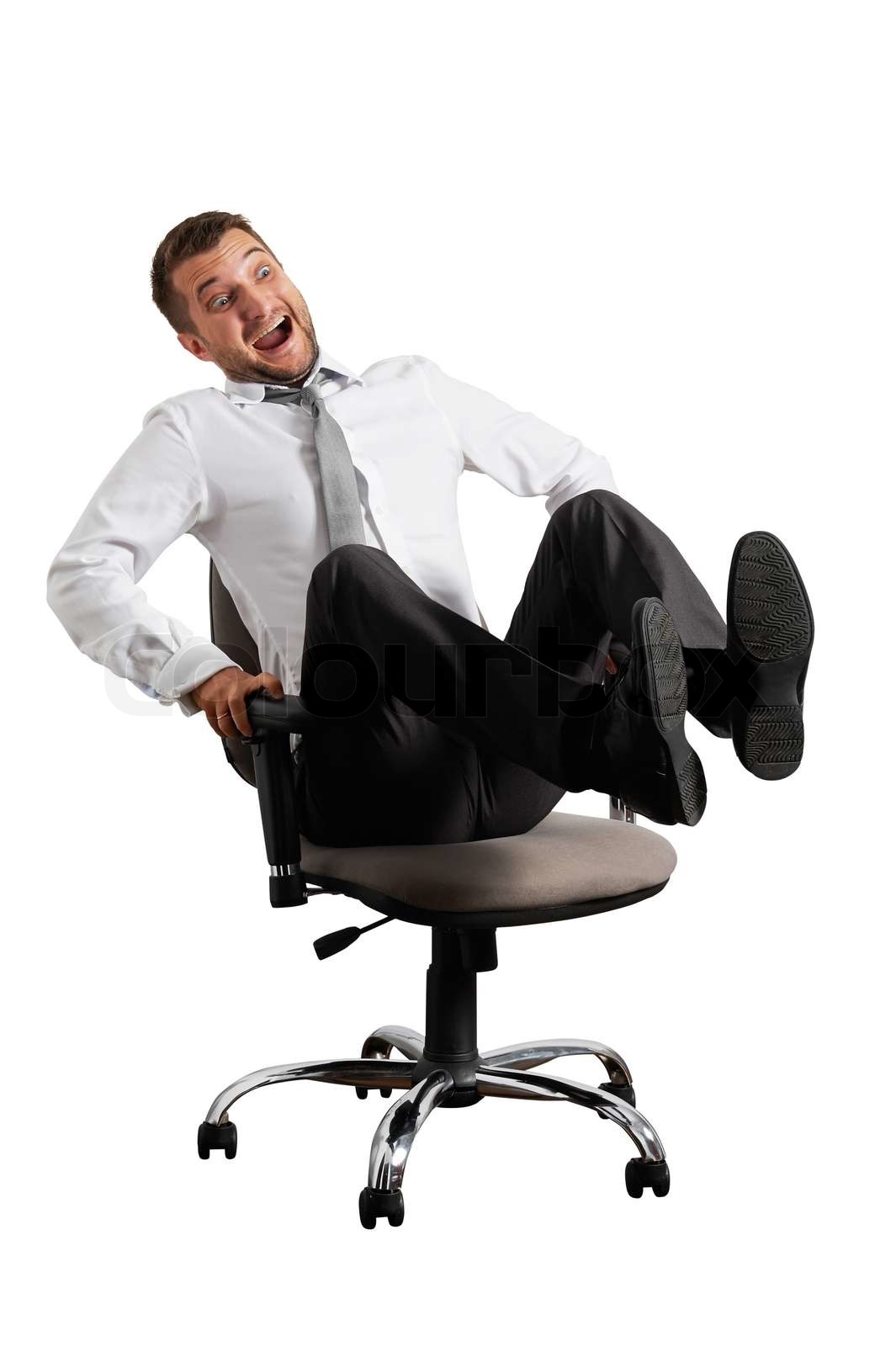 merry businessman rolling on the office chair Stock image Colourbox