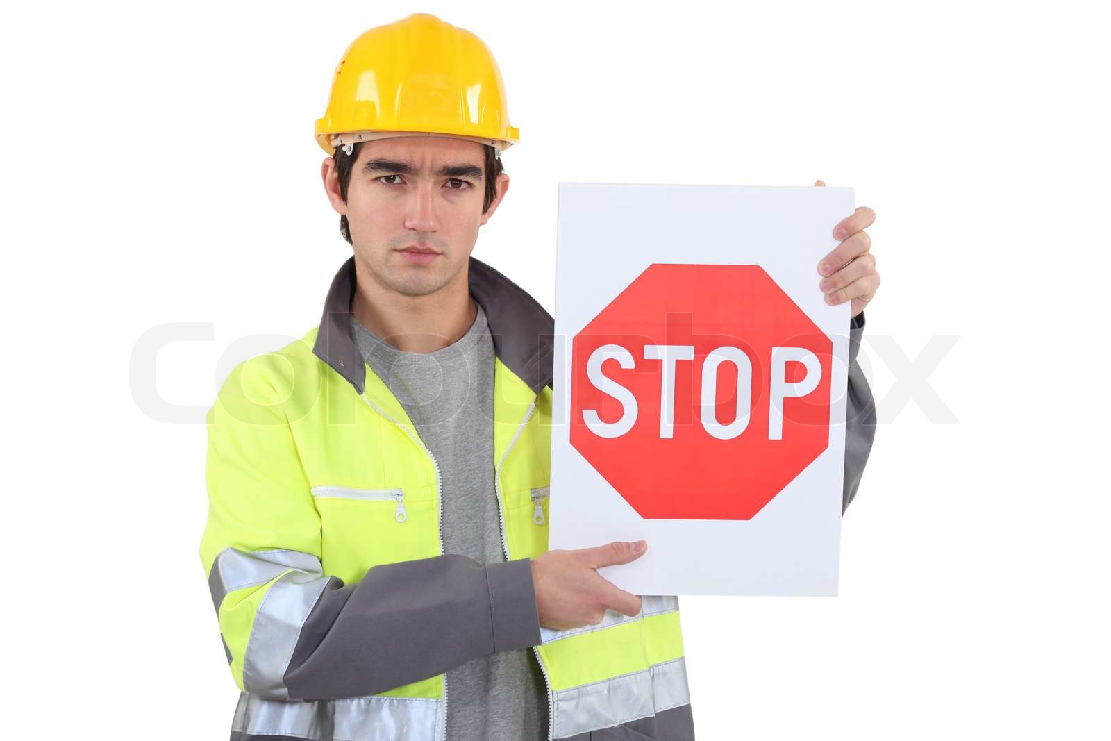 Worker holding stop sign | Stock image | Colourbox