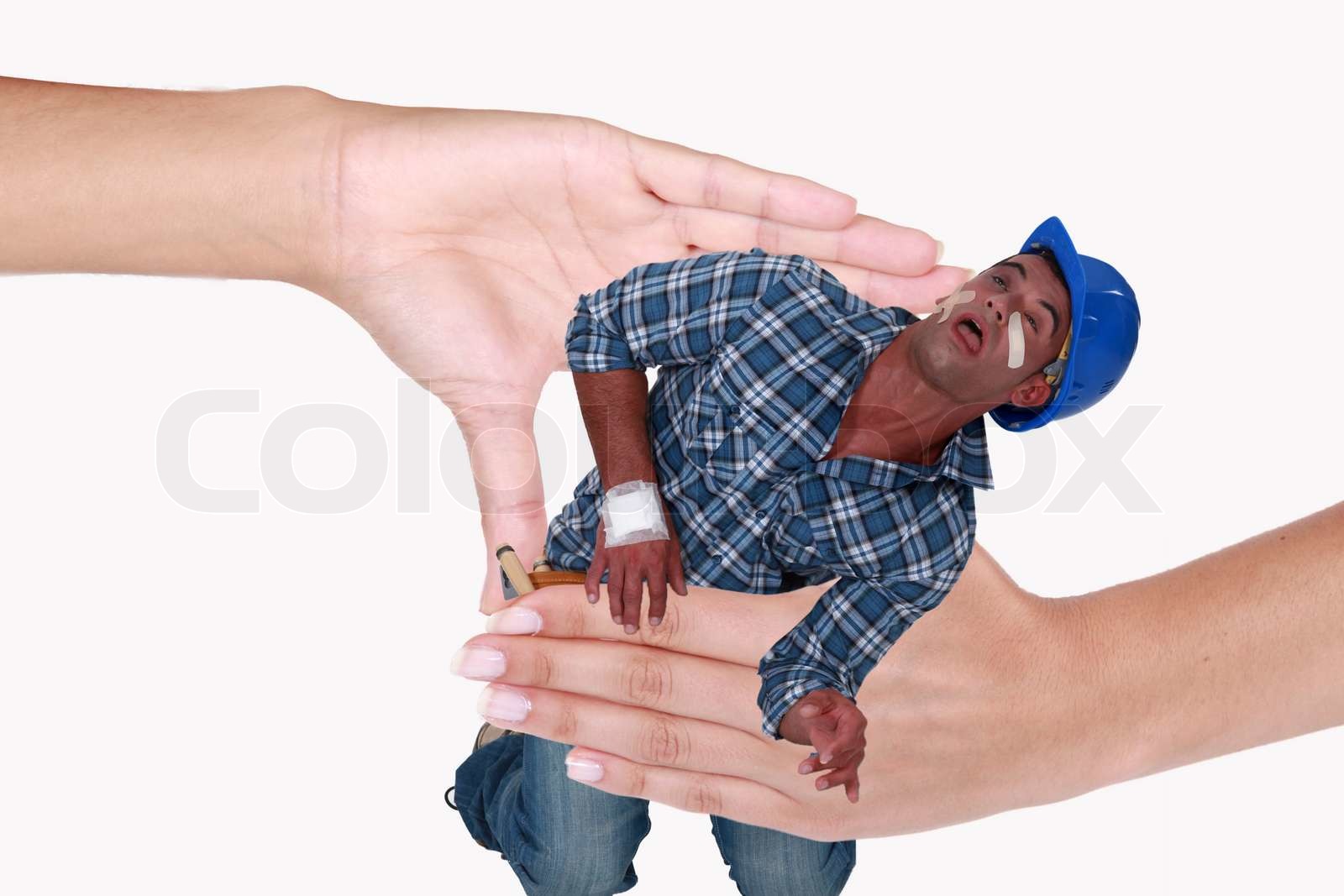 Photomontage of a man being crushed by hands of a woman Stock image