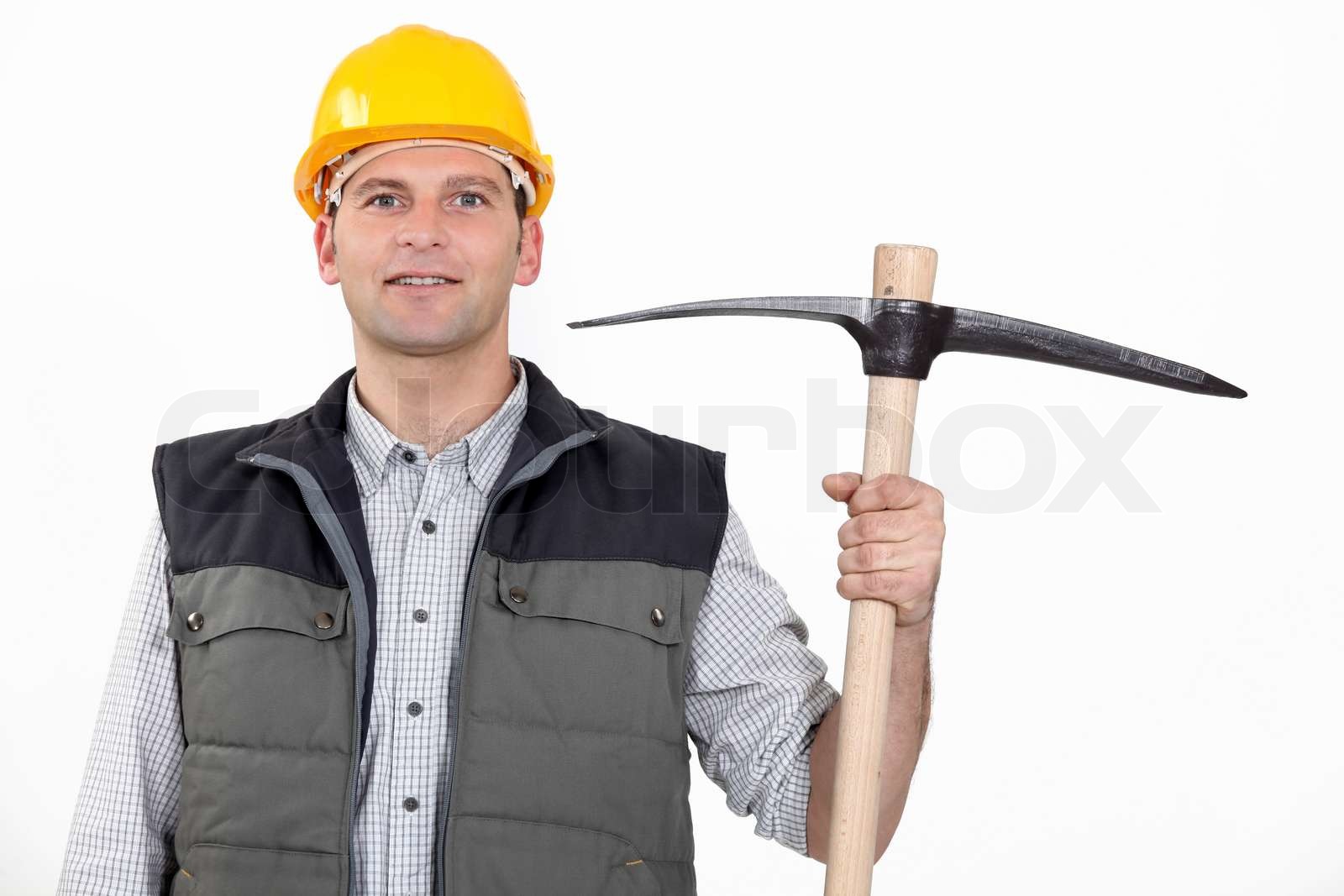 Man hält Spitzhacke Stock Bild Colourbox