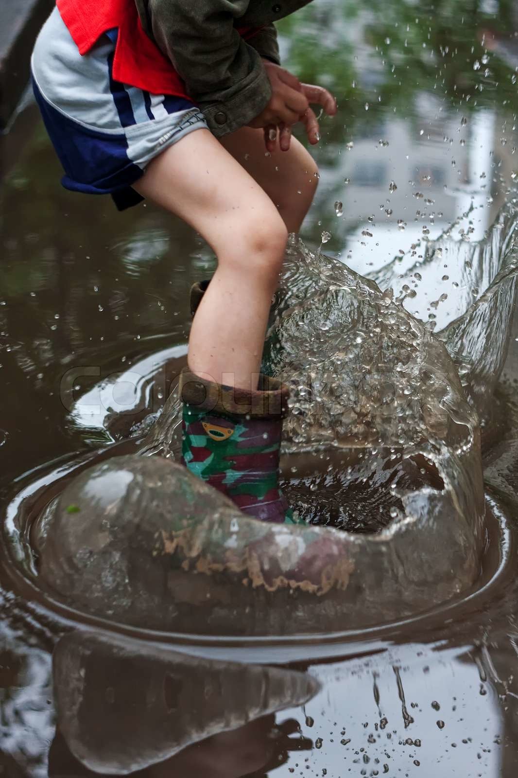 Splashing in Puddle | Stock image | Colourbox
