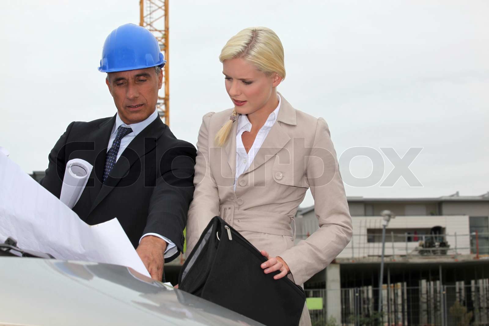 Architect and assistant visiting construction site Stock image