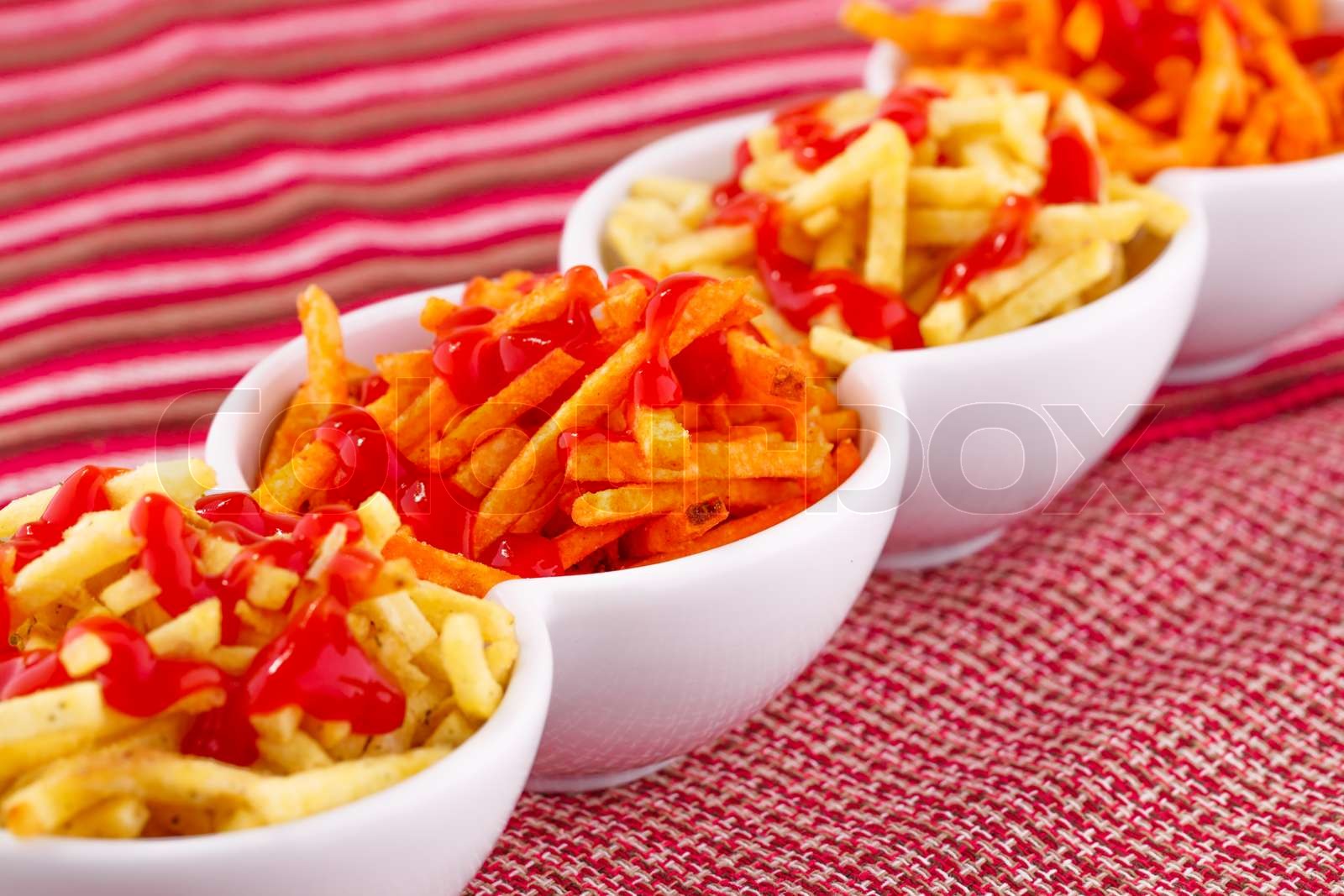 Potato chips with ketchup Stock image Colourbox