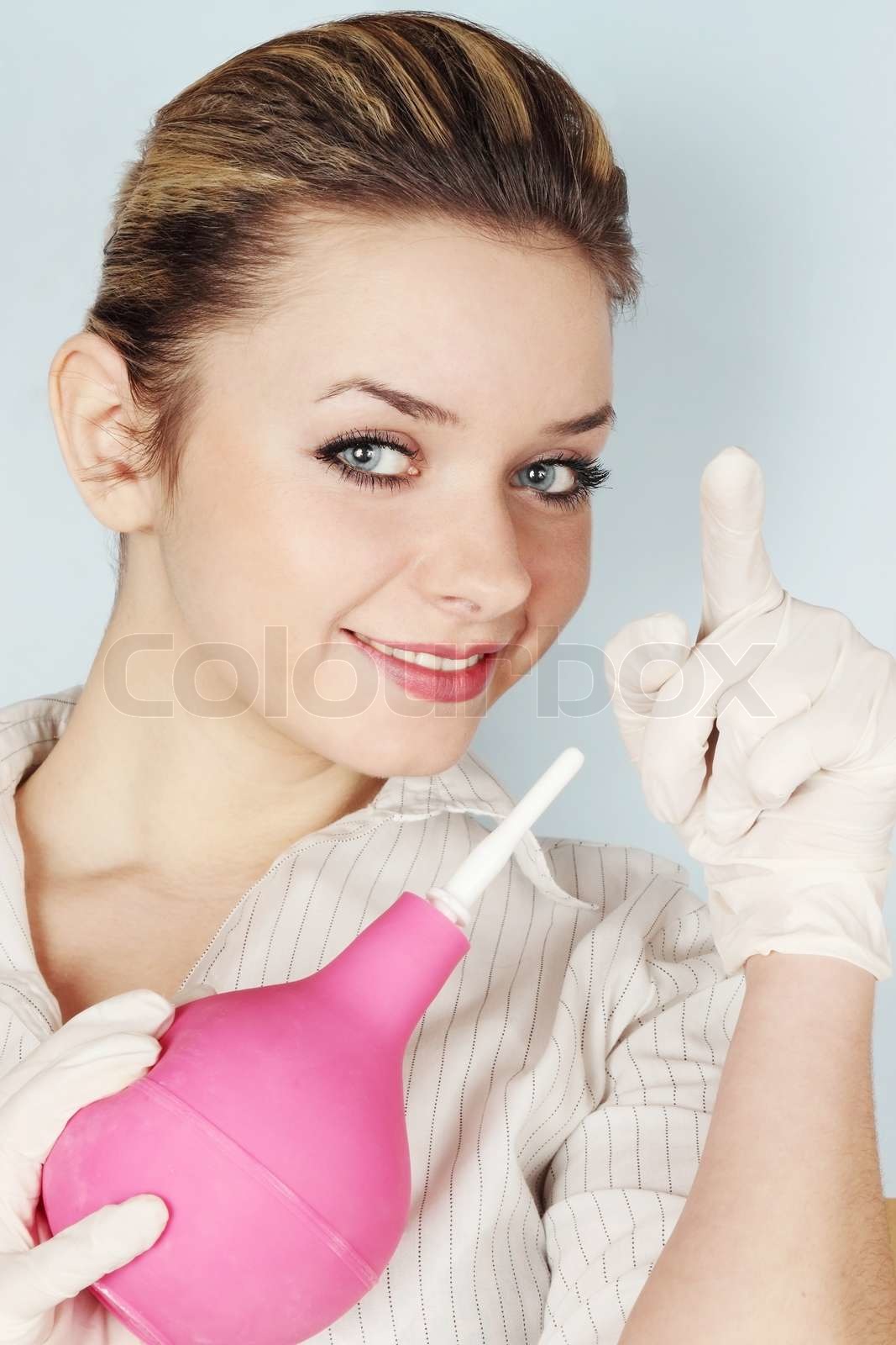 Woman with the enema | Stock image | Colourbox