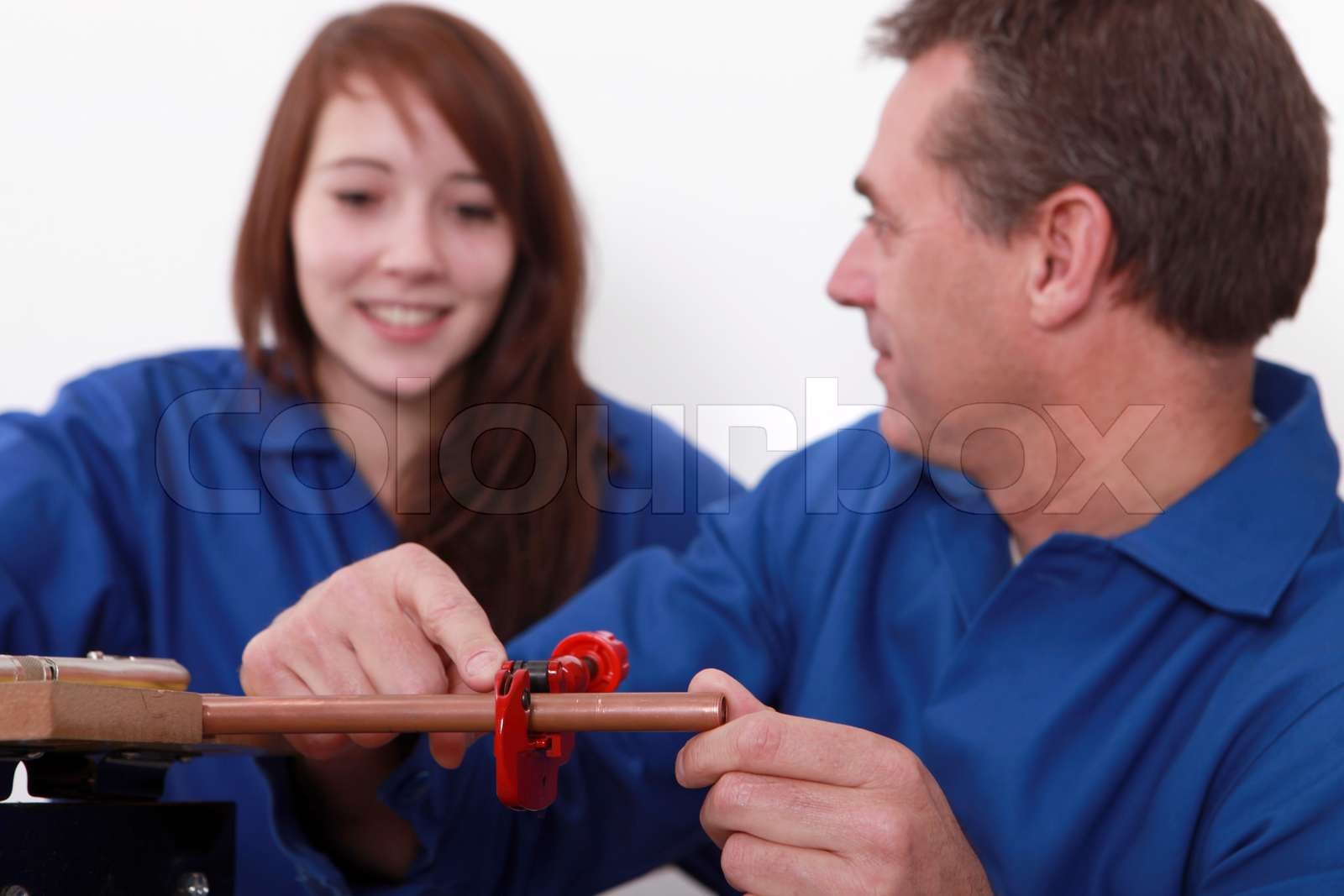 A plumber and his apprentice Stock image Colourbox