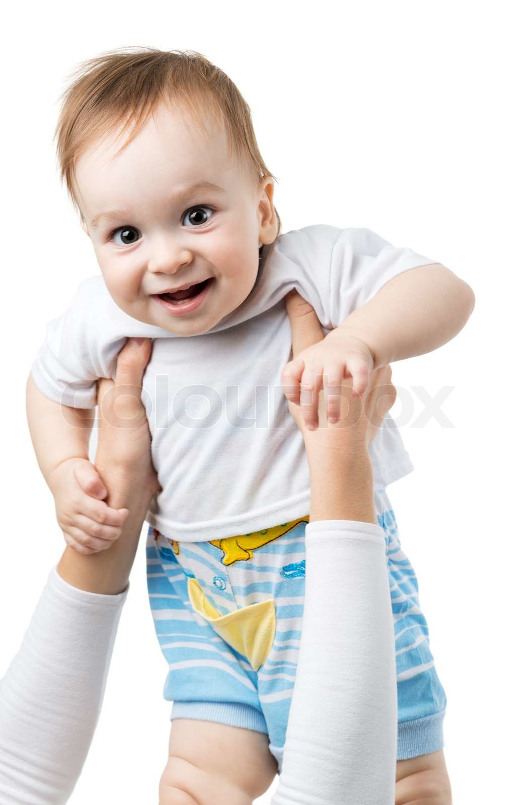 joyful baby throw up on hands Stock image Colourbox