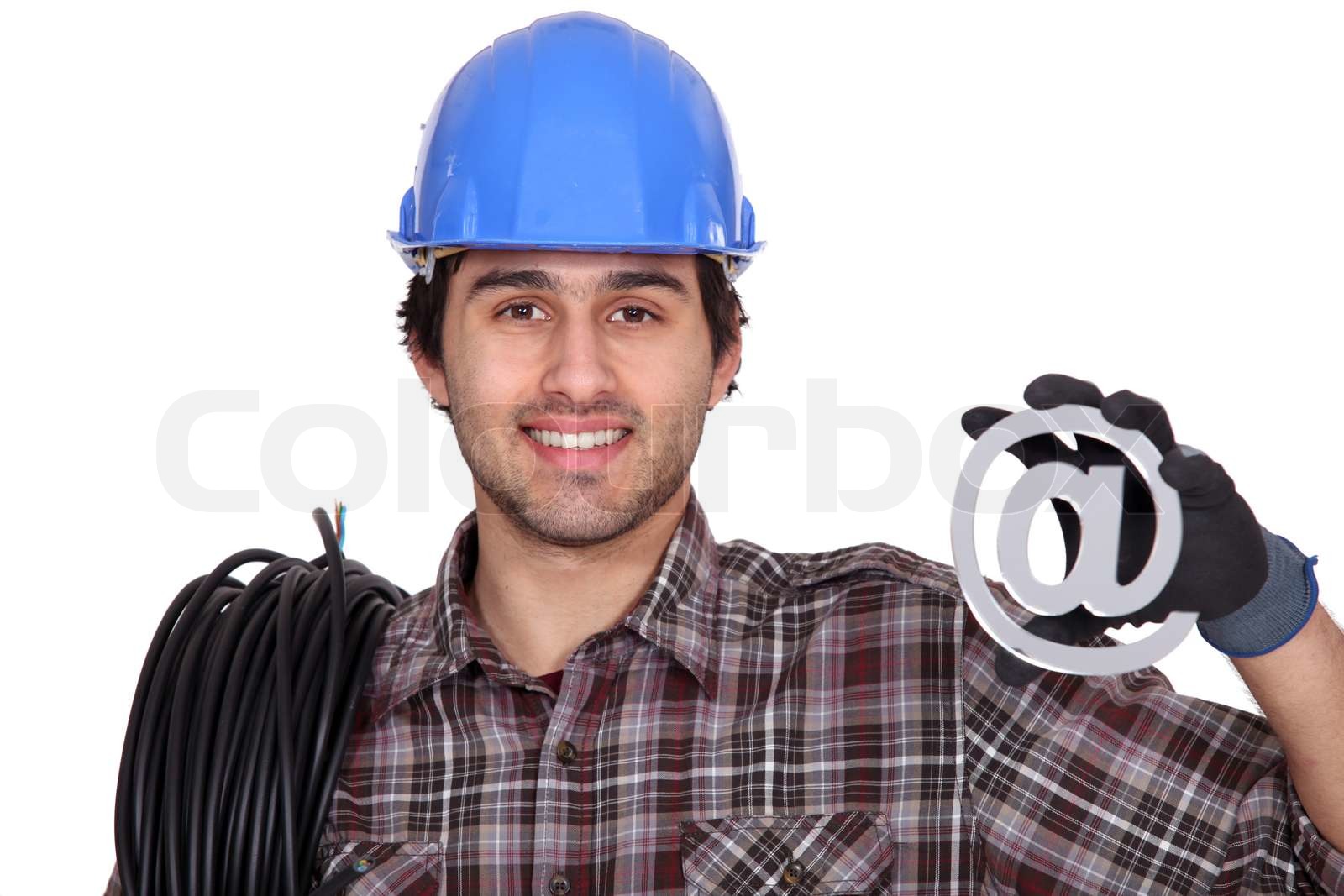 Electrician with an sign Stock image Colourbox