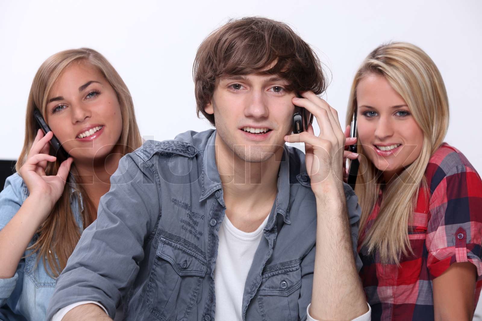Teenagere på telefonen | Stock foto | Colourbox