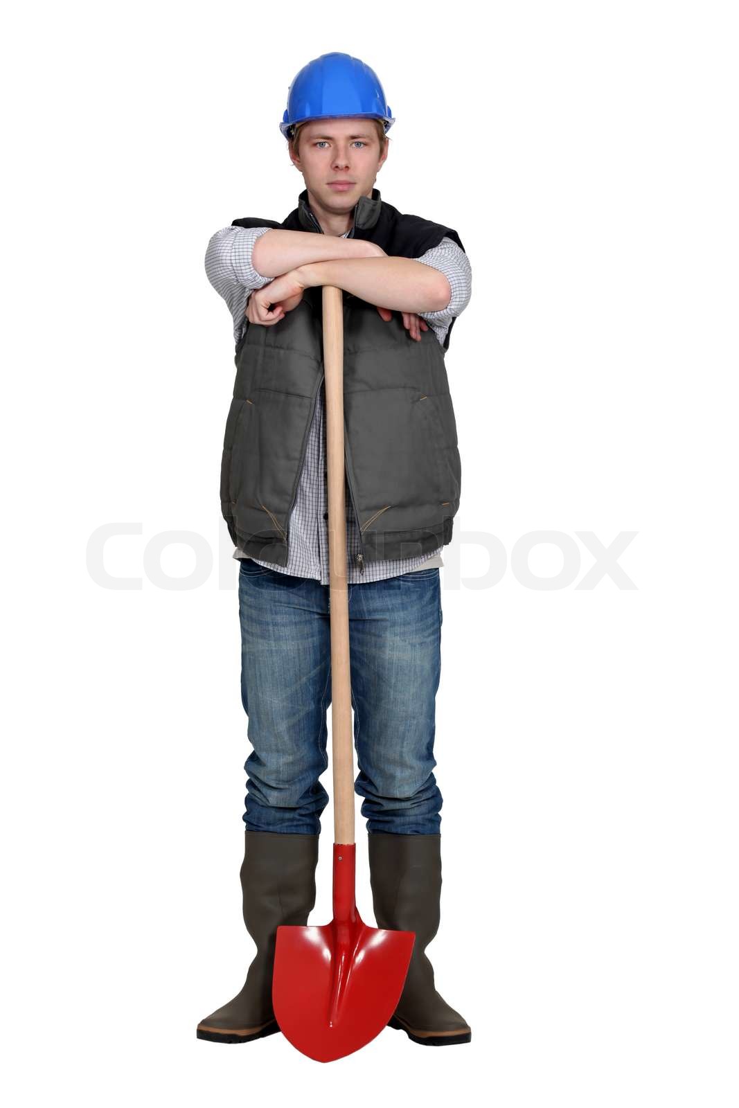 Man stood with shovel Stock image Colourbox