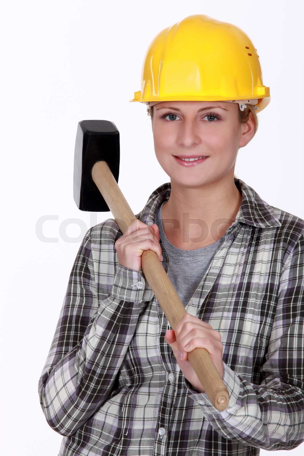 Woman holding sledgehammer Stock image Colourbox