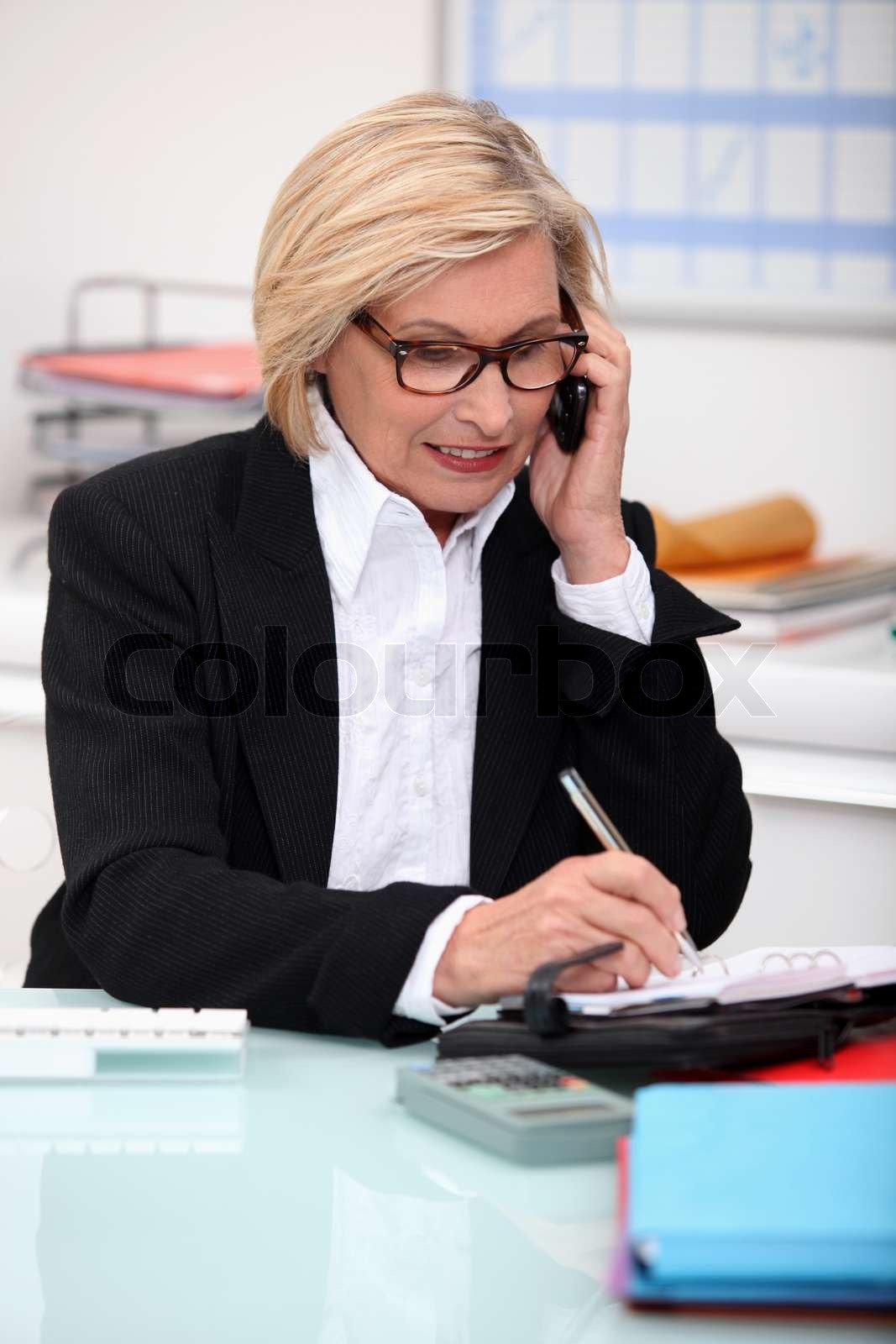 Sekretär Taking notes | Stock Bild | Colourbox