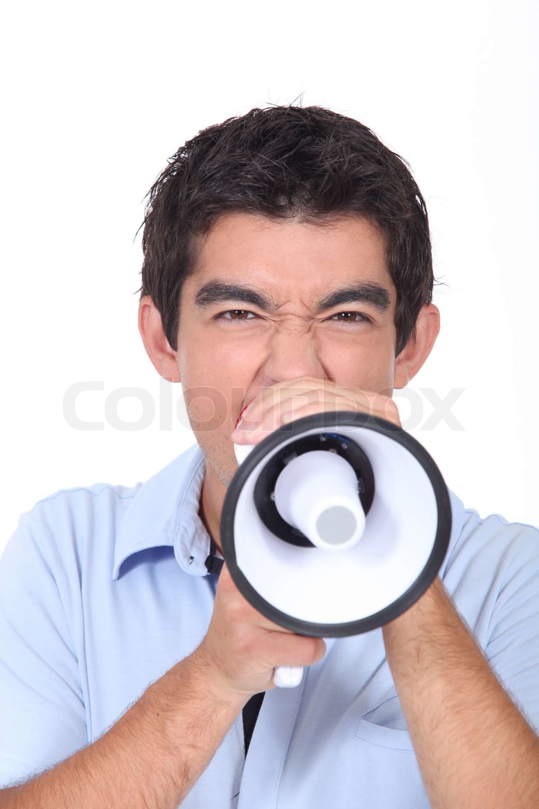 Shouting into loud speaker Stock image Colourbox