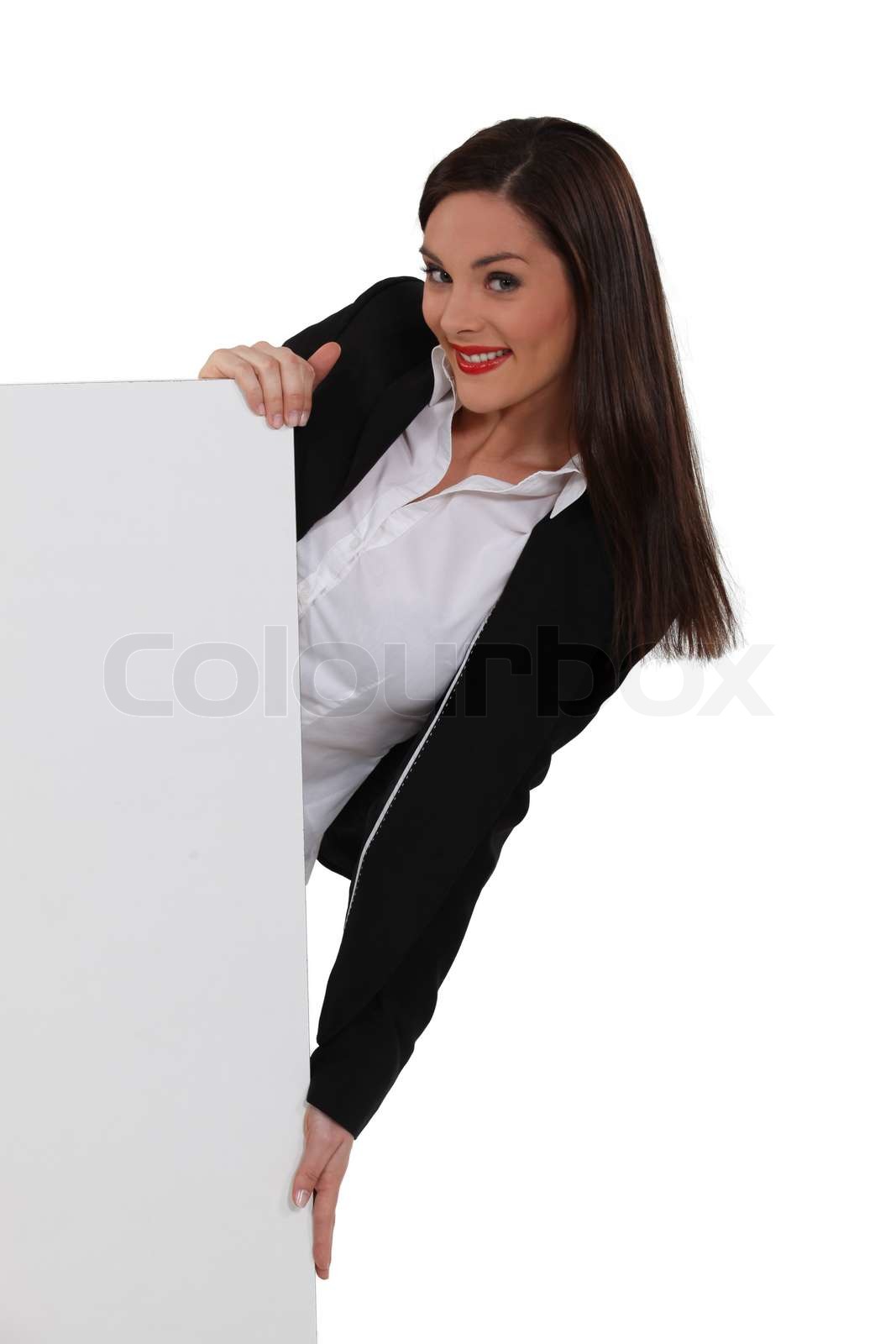 Attractive woman holding a blank sign Stock image Colourbox