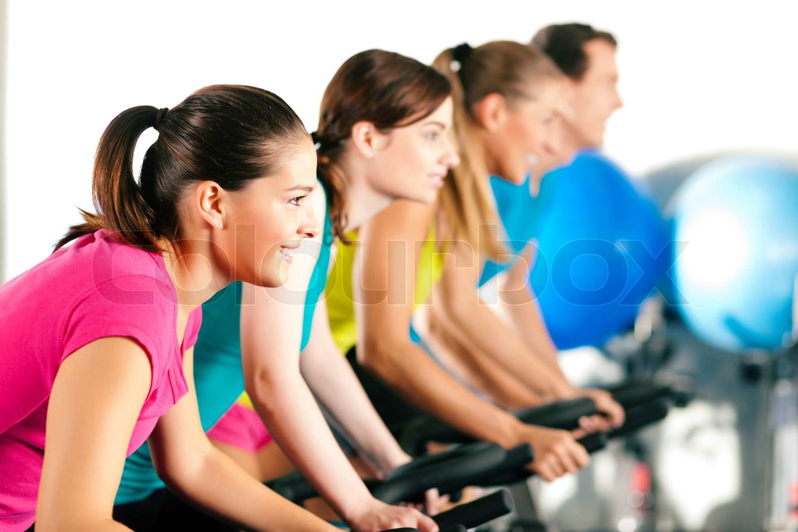 Indoor bycicle cycling in gym | Stock image | Colourbox