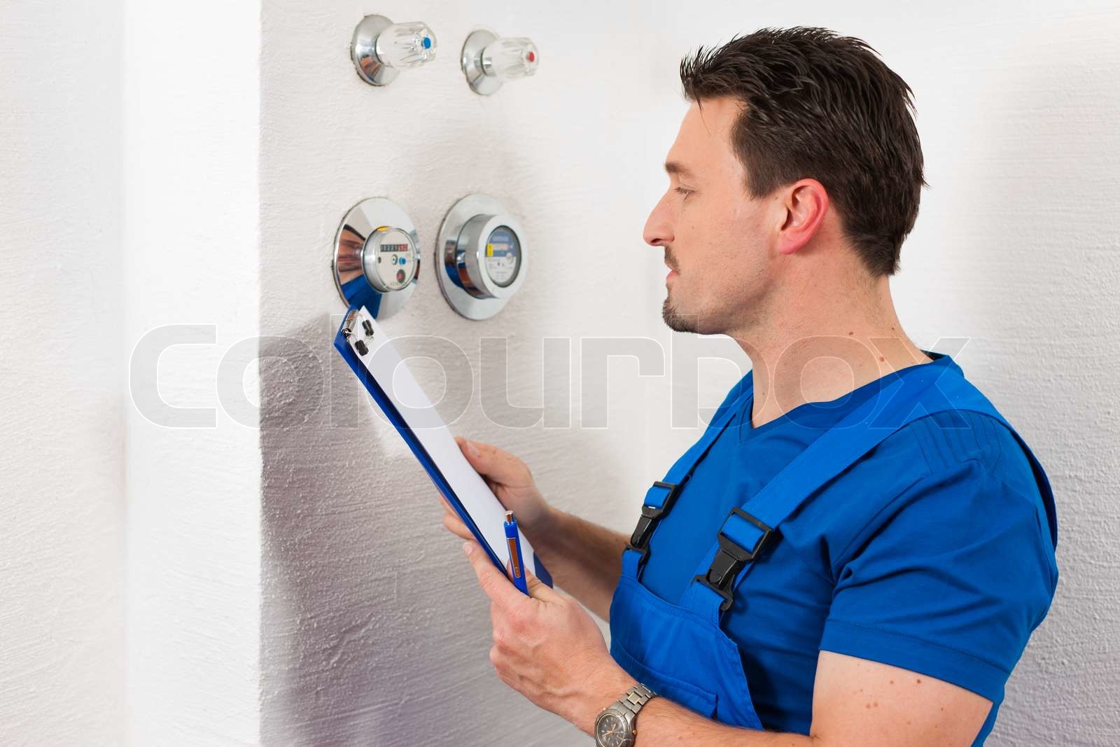 technician-reading-the-water-meter-stock-image-colourbox