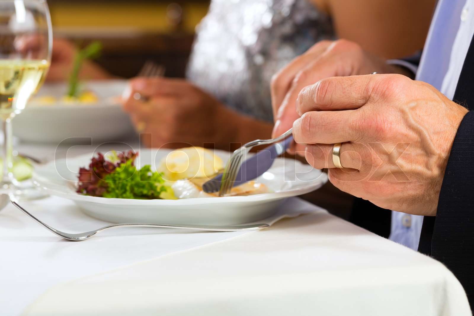 A person enjoying a private dining experience in an upscale restaurant
