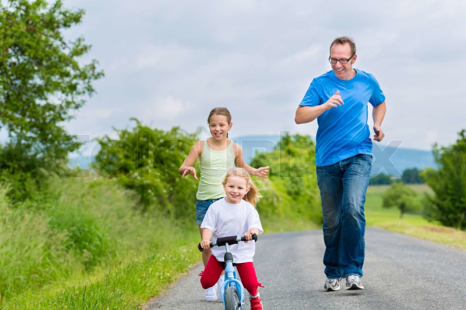 Run With Daughter Rfds Father and daughters running on street | Stock image | Colourbox