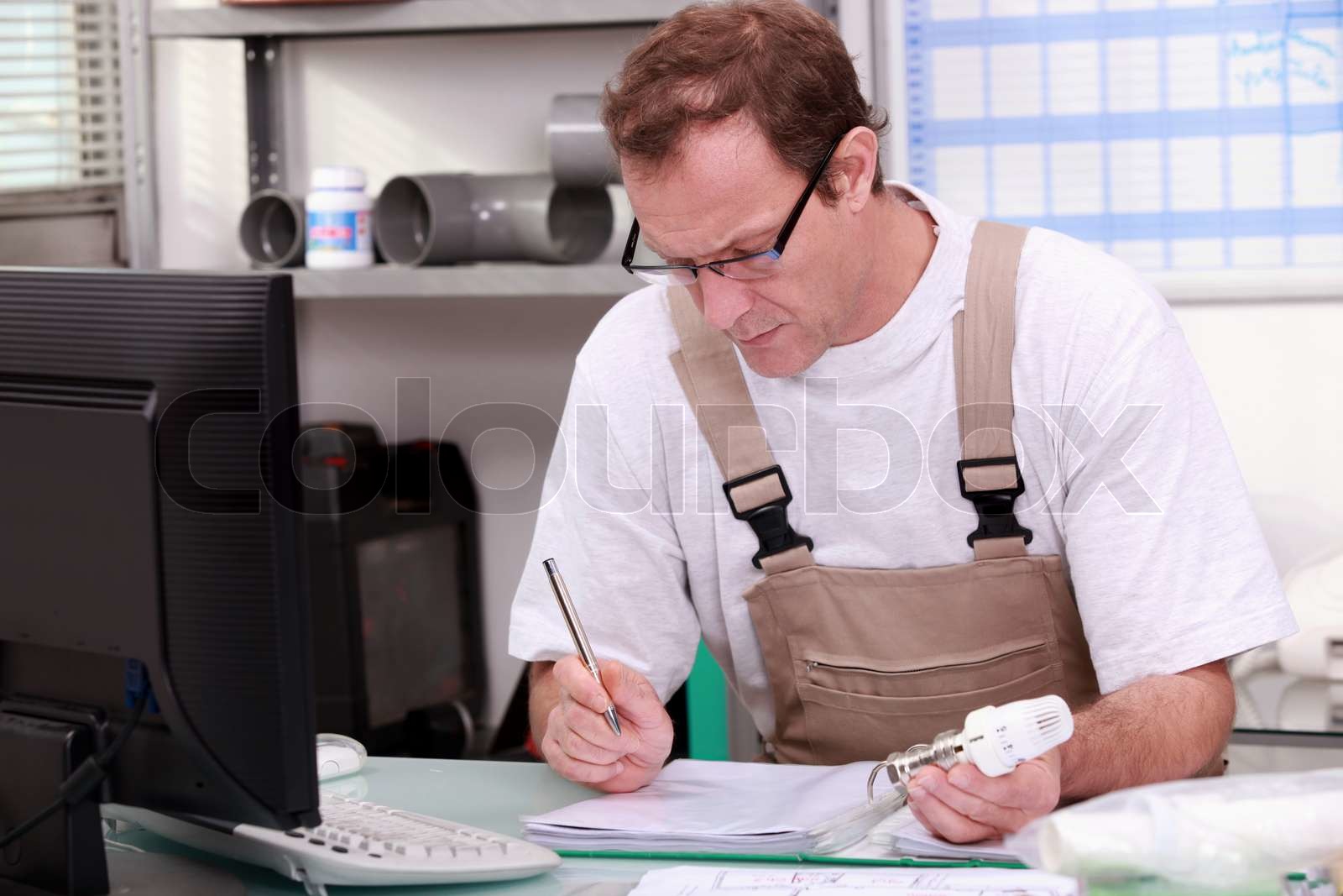 Man checking inventory | Stock image | Colourbox