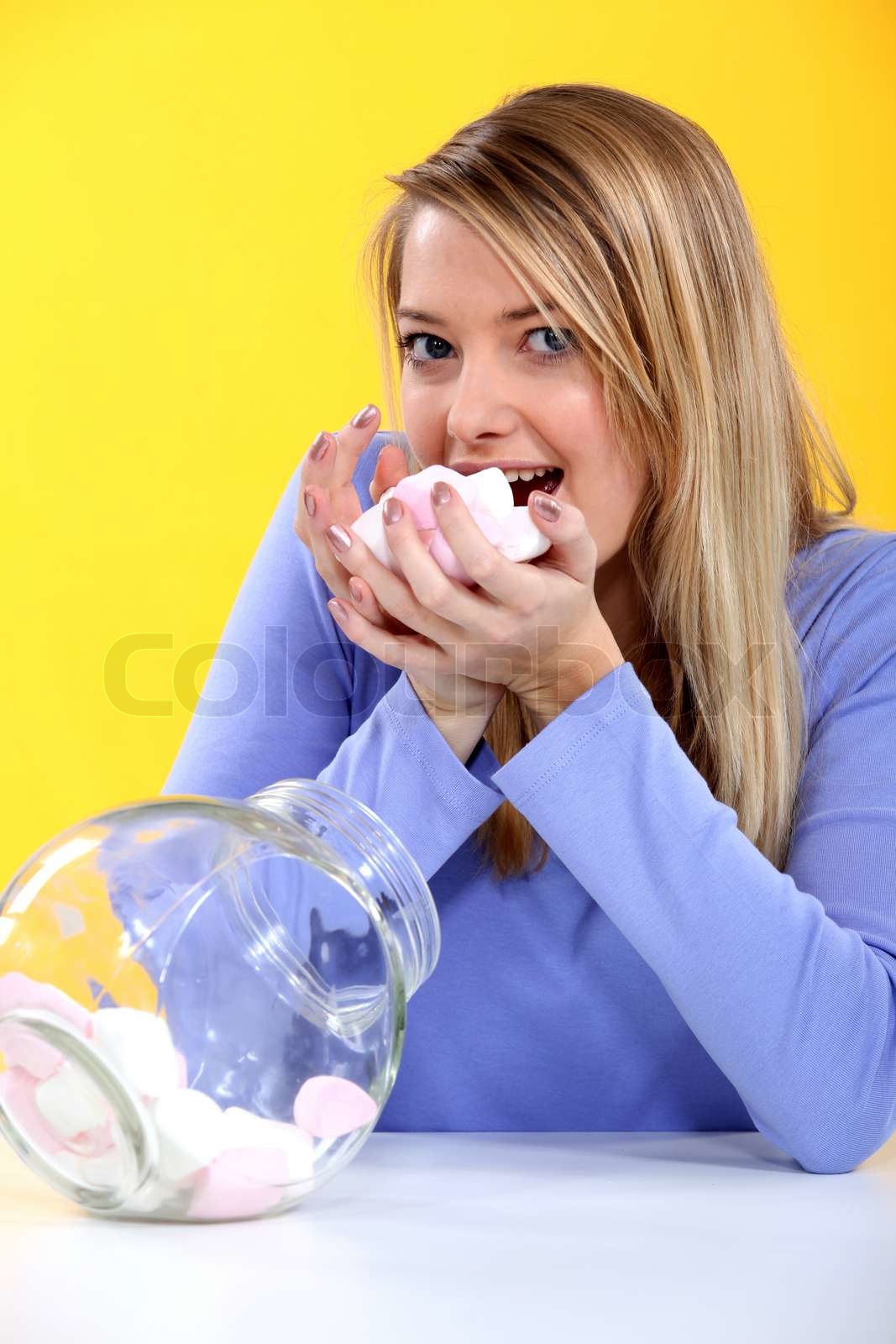 woman eating candy | Stock image | Colourbox