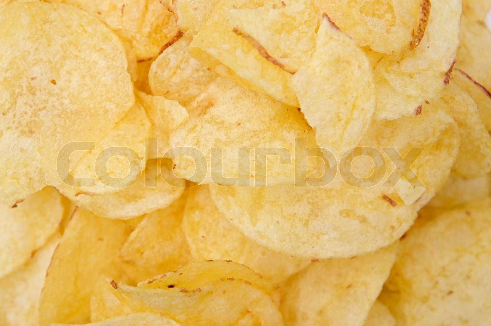 A pile of potato chips Stock image Colourbox