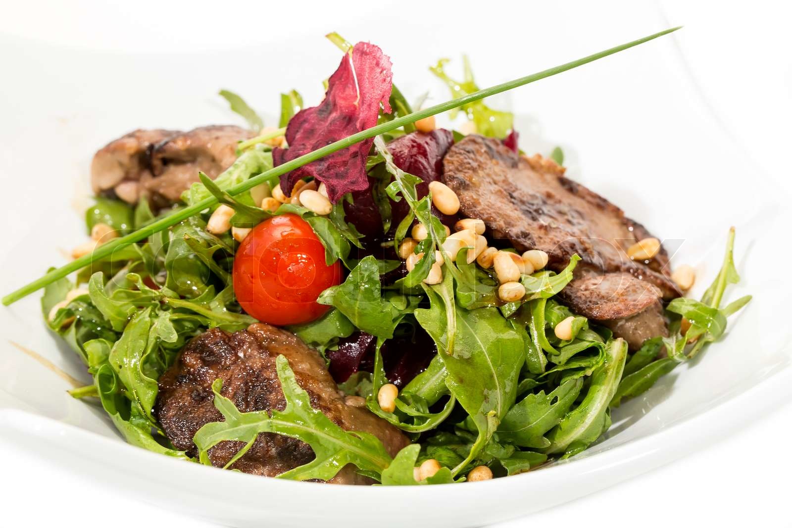 Kaninchen LeberSalat mit Rucola in einem restaurant Stock Bild Colourbox