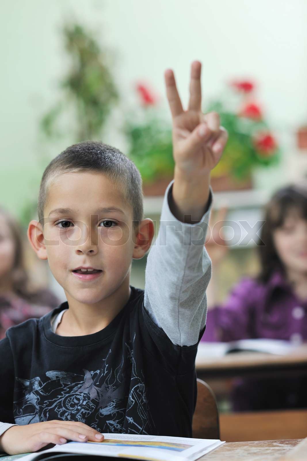 Happy young boy at first grade math classes stock image colourbox