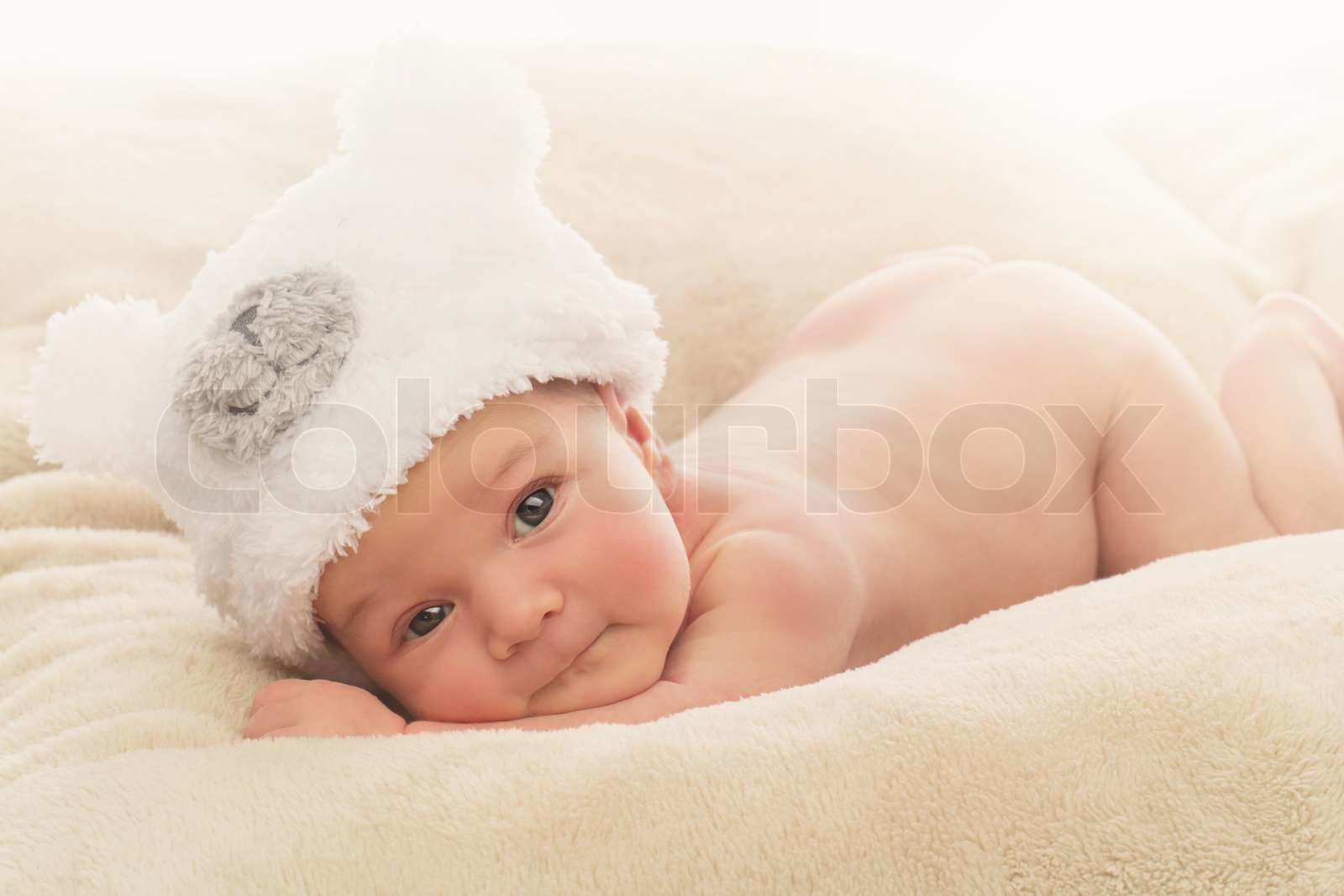 Newborn baby in funny hat | Stock image | Colourbox