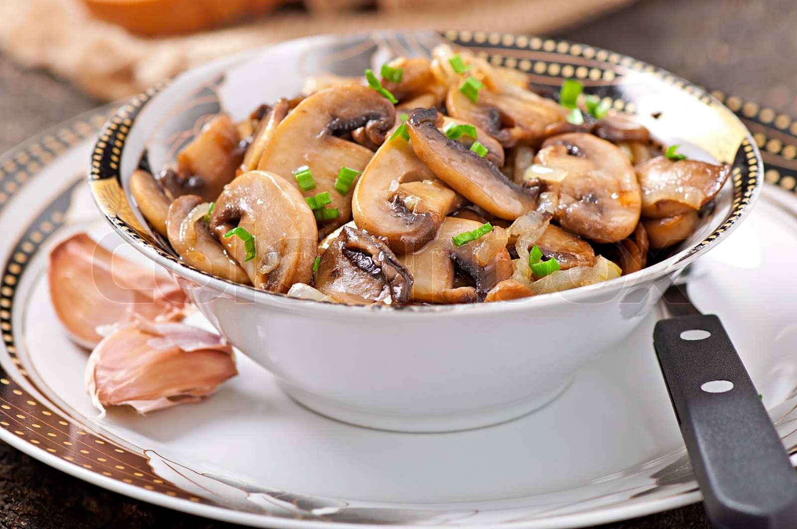 Fried mushrooms and onions | Stock image | Colourbox