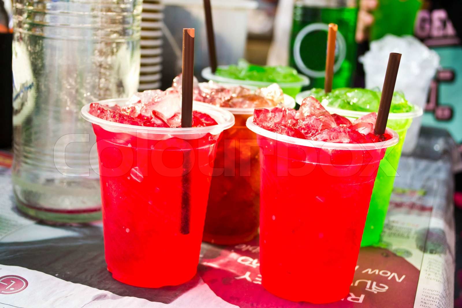 Soft drinks in plastic cups Stock image Colourbox