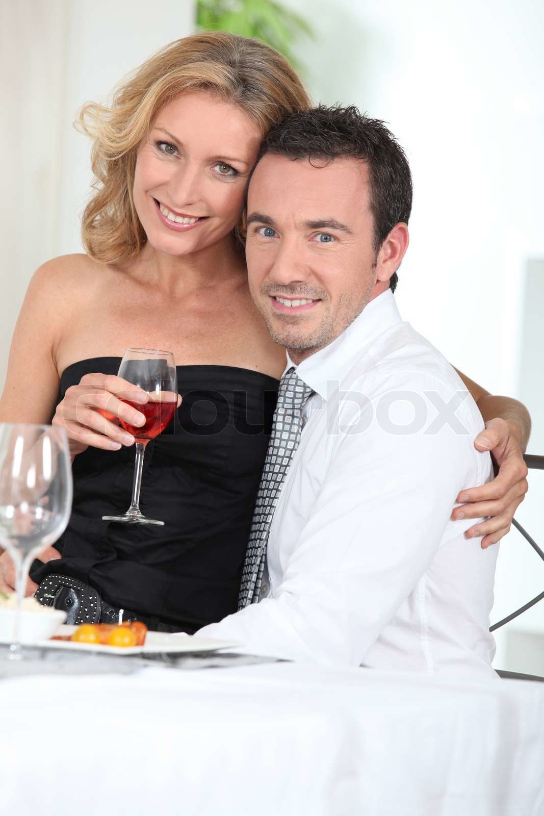 Woman sitting on a man