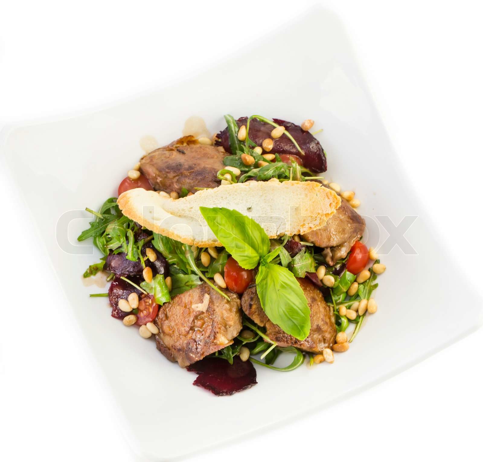 Kaninchen LeberSalat mit Rucola in einem restaurant Stock Bild Colourbox
