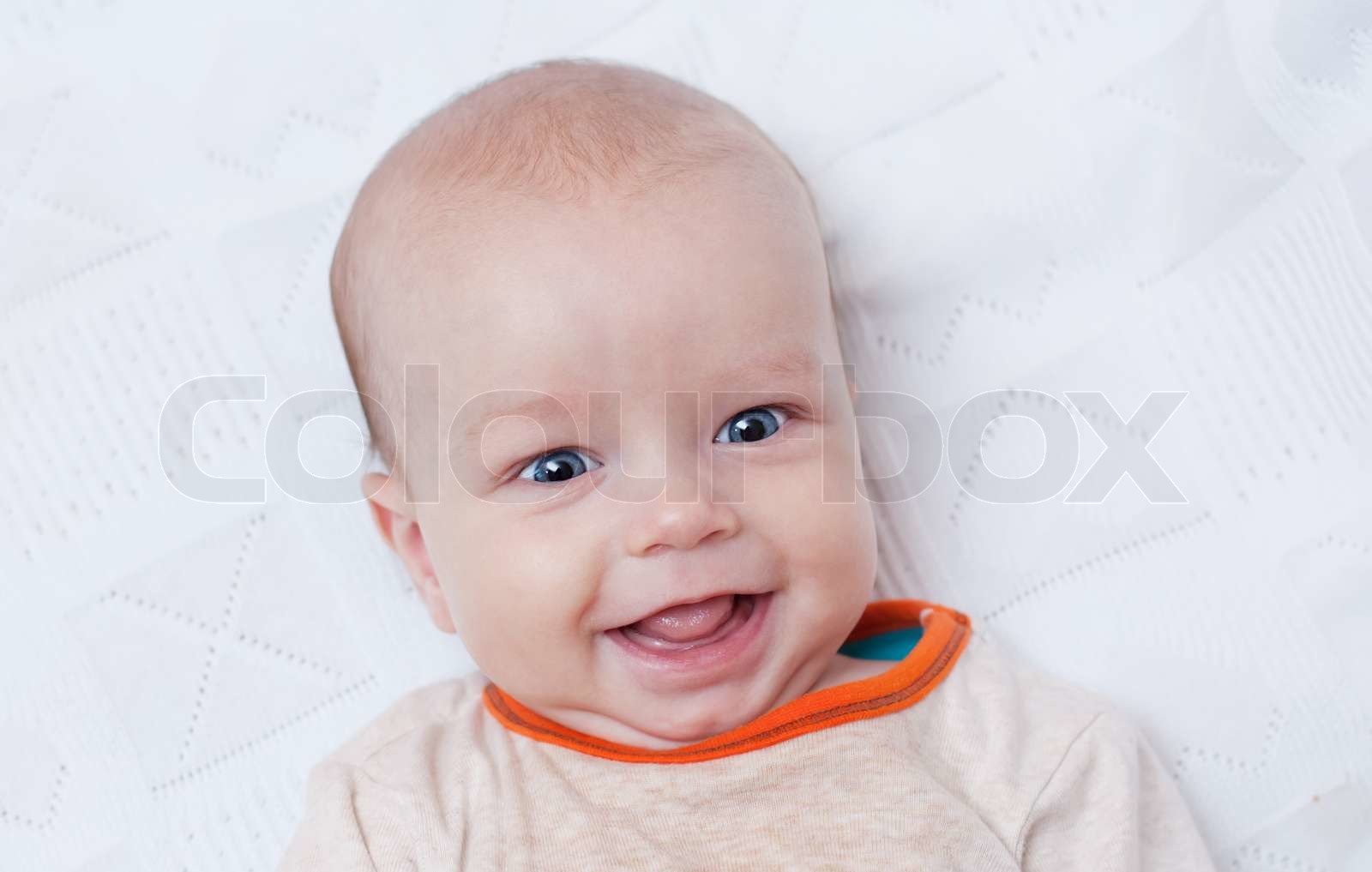 Cute newborn baby smiling | Stock image | Colourbox
