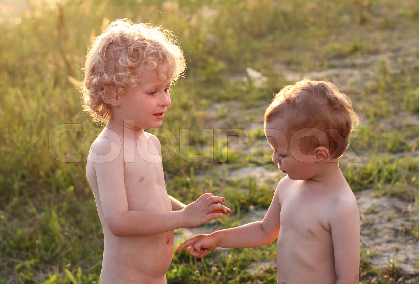 two little children communicate Stock image Colourbox