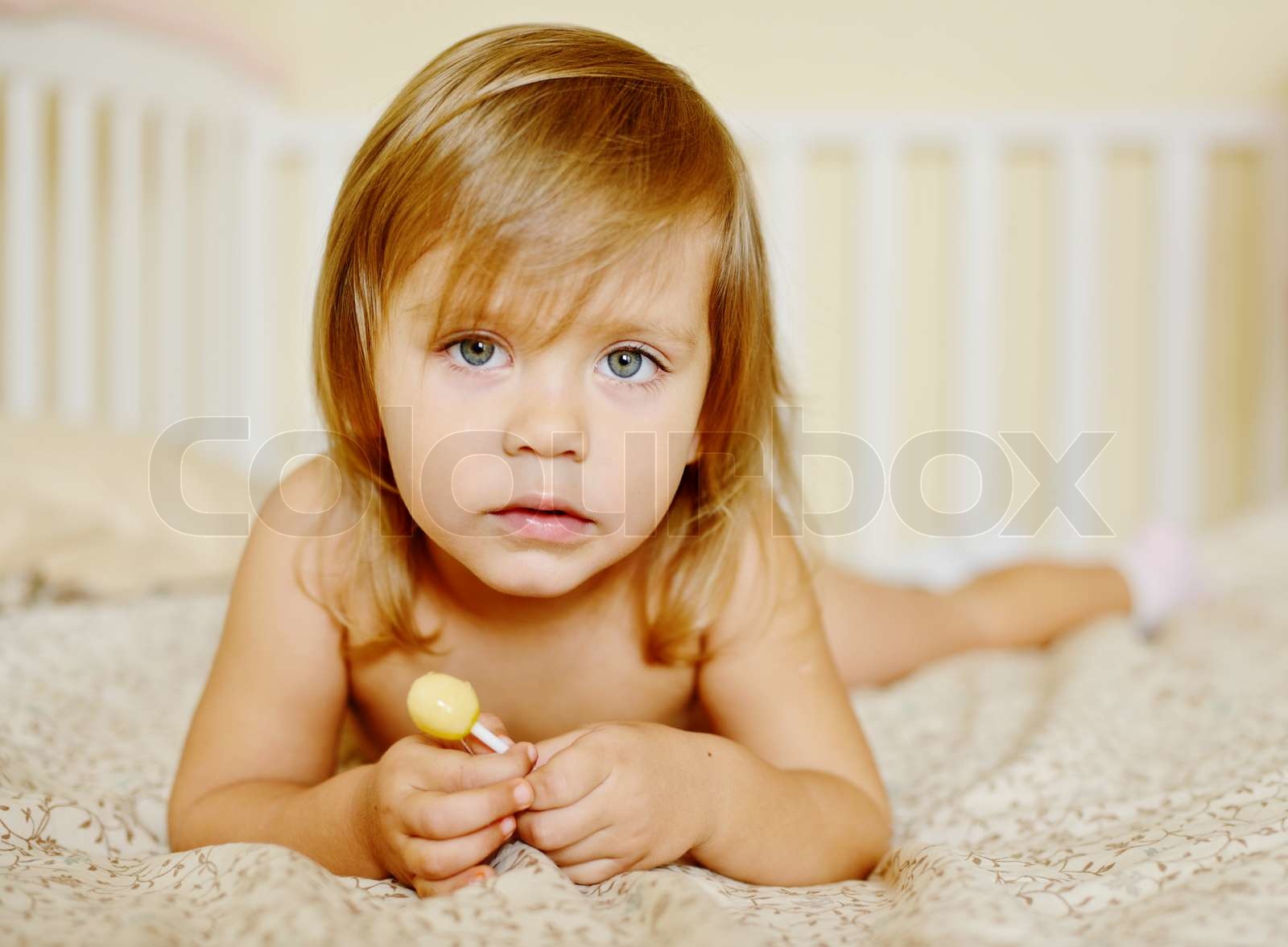 toddler with lollipop Stock image Colourbox