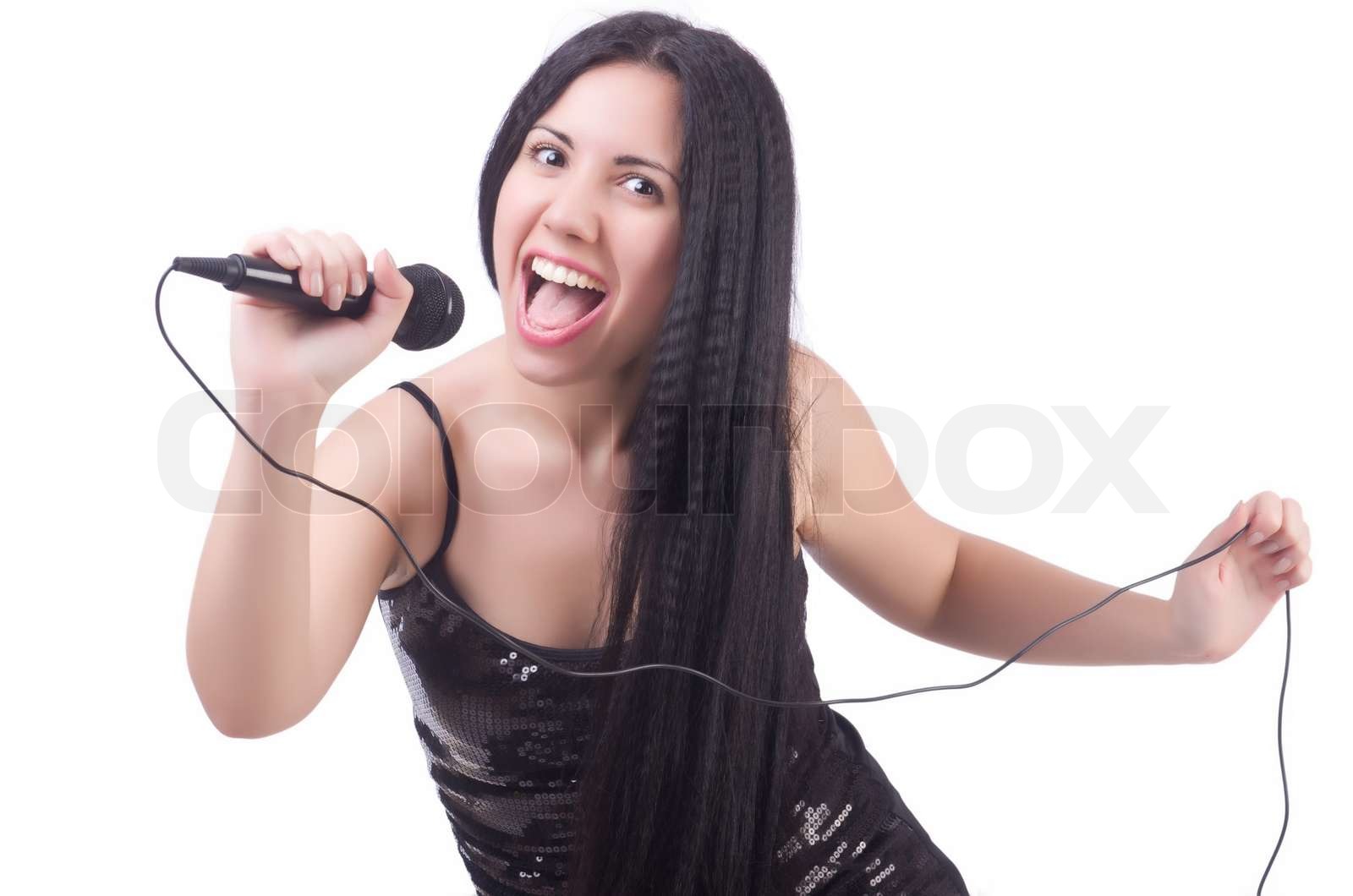 Young female singer with mic on white | Stock image | Colourbox