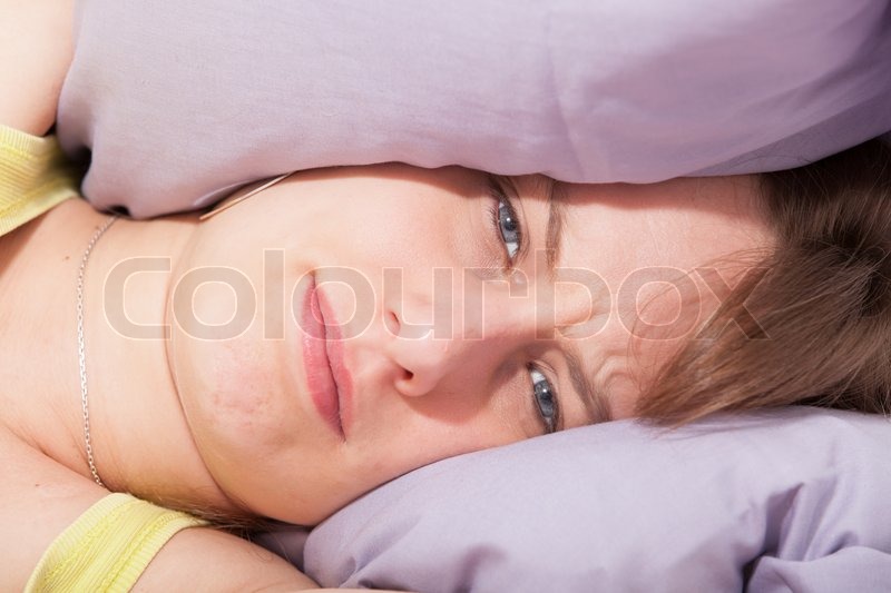 Woman With Her Head Under Her Pillow Stock Image Colourbox