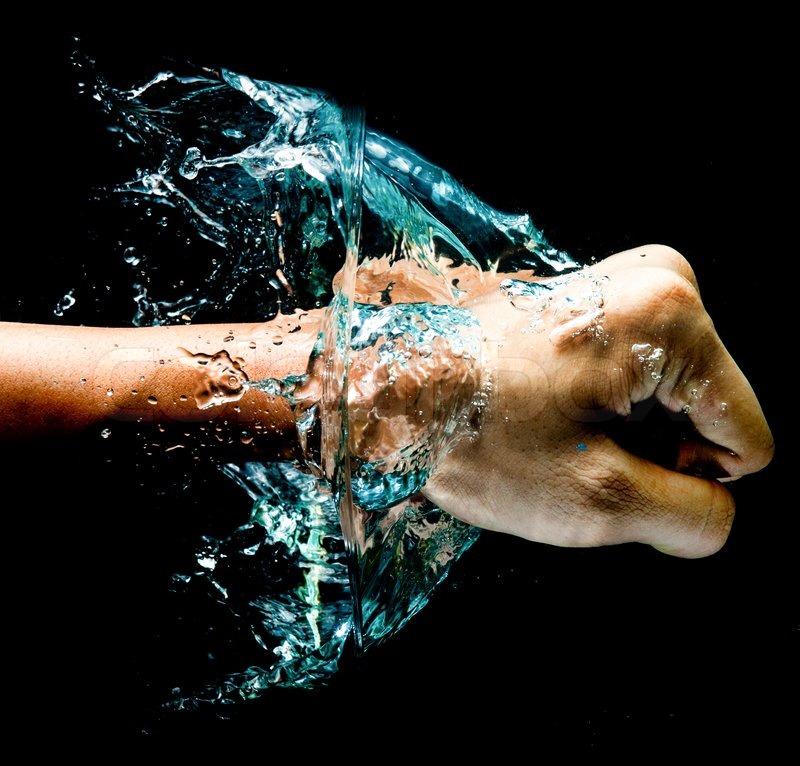 Fist punch into water with big Stock Photo Colourbox