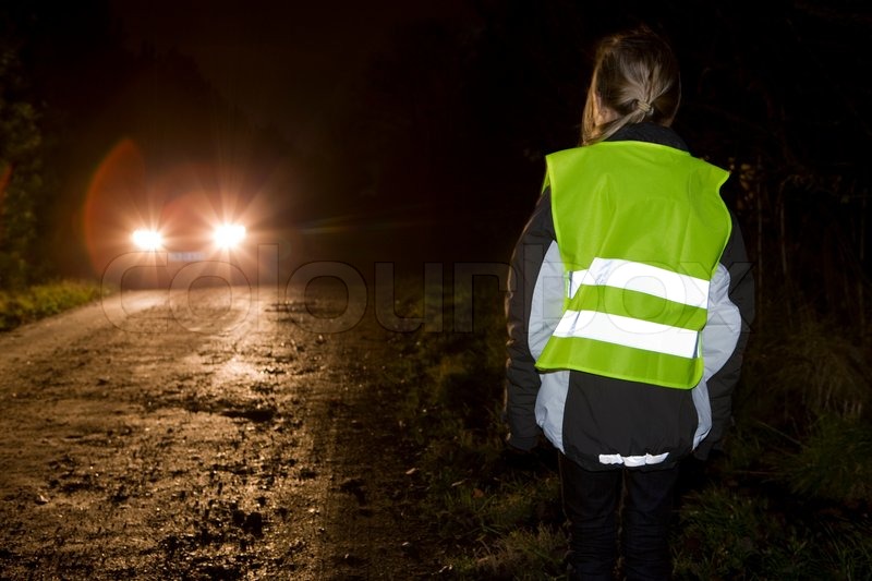 A woman wearing a vest with reflector Stock Photo Colourbox