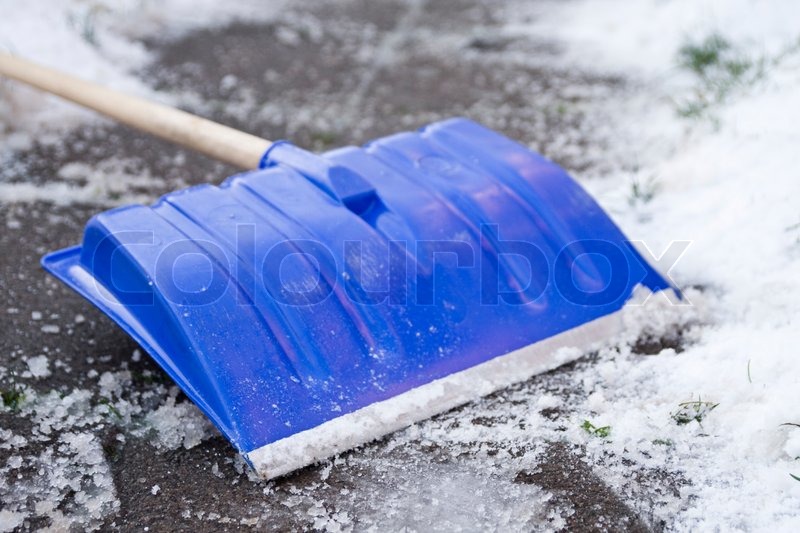A blue snow shovel | Stock image | Colourbox
