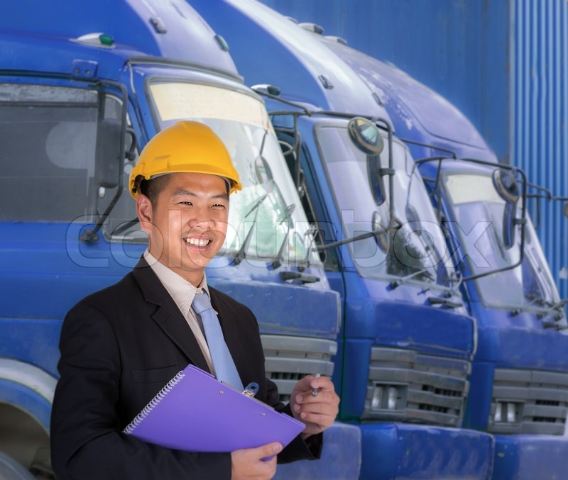 Transportation engineer with trucks of Stock image Colourbox