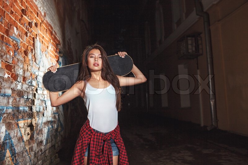 Beautiful Asian Teen Girl With Skate Board On Shouldres Outdoors Urban Lifestyle Stock