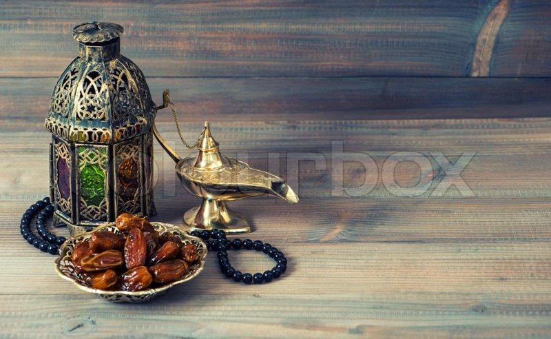 Dates, arabian lantern and rosary. Islamic holidays 