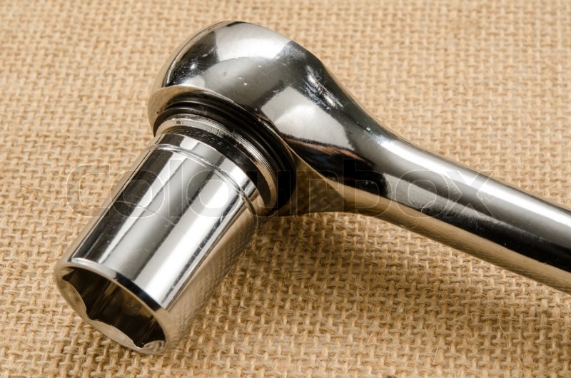 Part of socket wrench on brown sack Stock image Colourbox